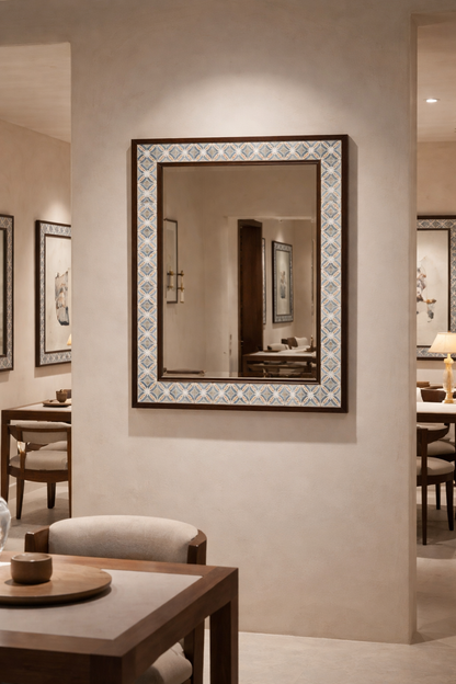 Living room with a fireplace, mirror, and decorative items.